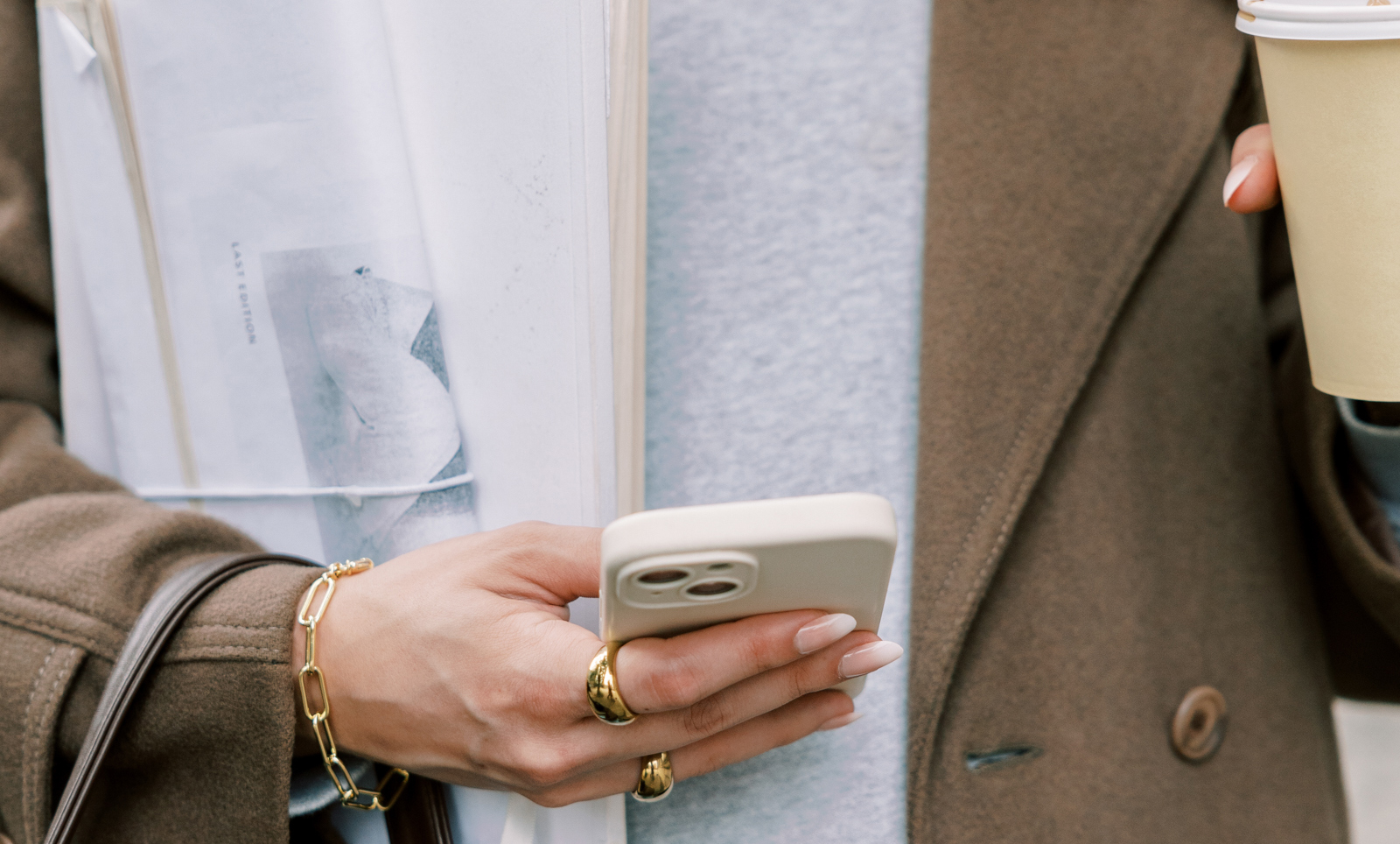 photo of woman holding a phone reordering her instagram grid